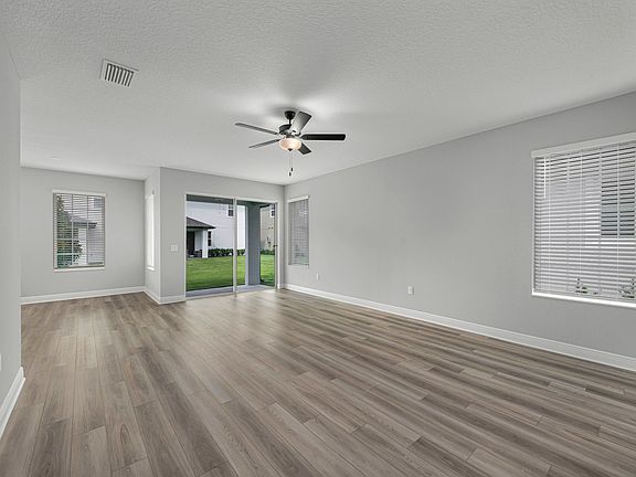 The family room is spacious and has easy access to the back patio