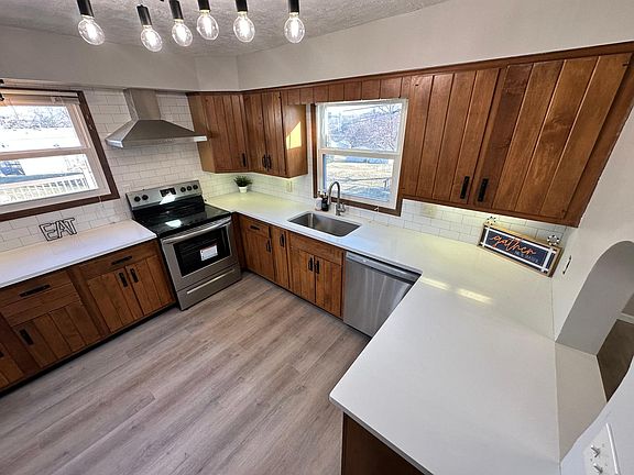 Quartz countertop and tile backsplash