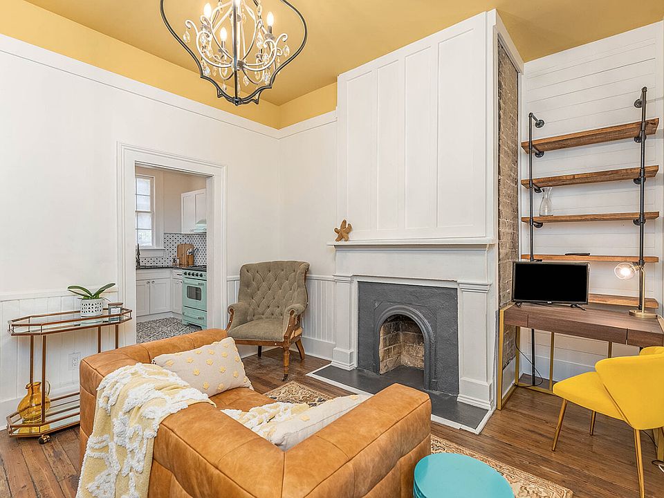 Desk, sitting chair and decorative fireplace