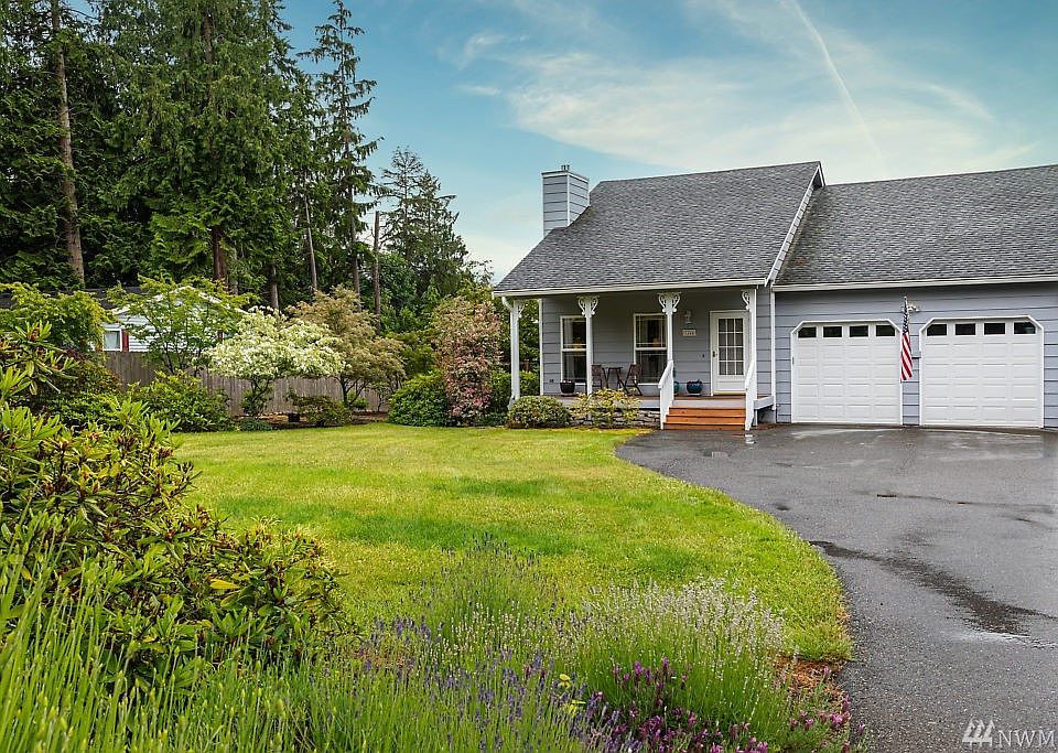 Curb appeal galore!  Here is a colorful yard to enjoy through the seasons.