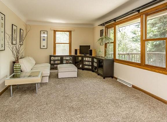 Bright and open living room. Fresh paint and newer carpet.