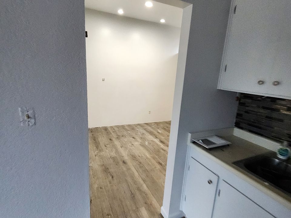 Bedroom entry, new flooring, recessed lighting and paint.