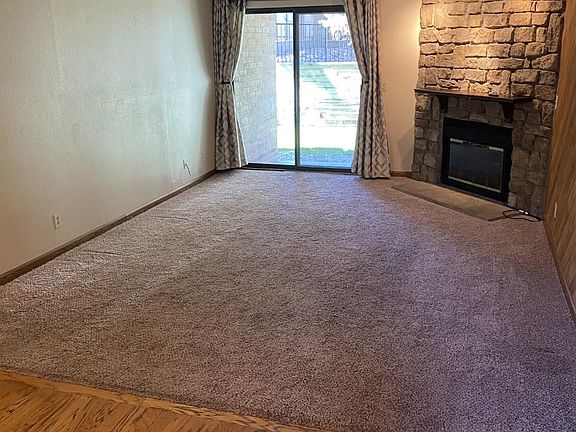 Large living area with electric fireplace.