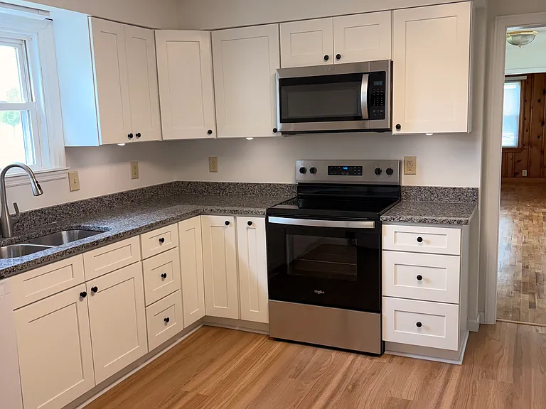 kitchen with new oven and microwave