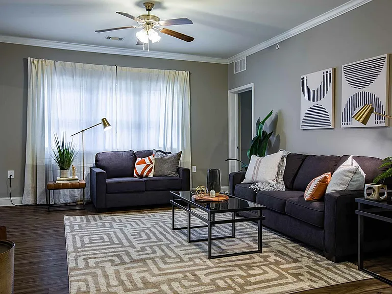 Experience ultimate comfort in this stylishly designed living room, perfect for relaxation.