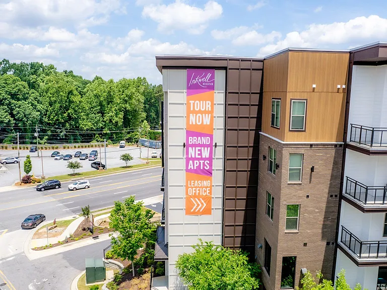 Exterior of Building, Now Leasing Banner