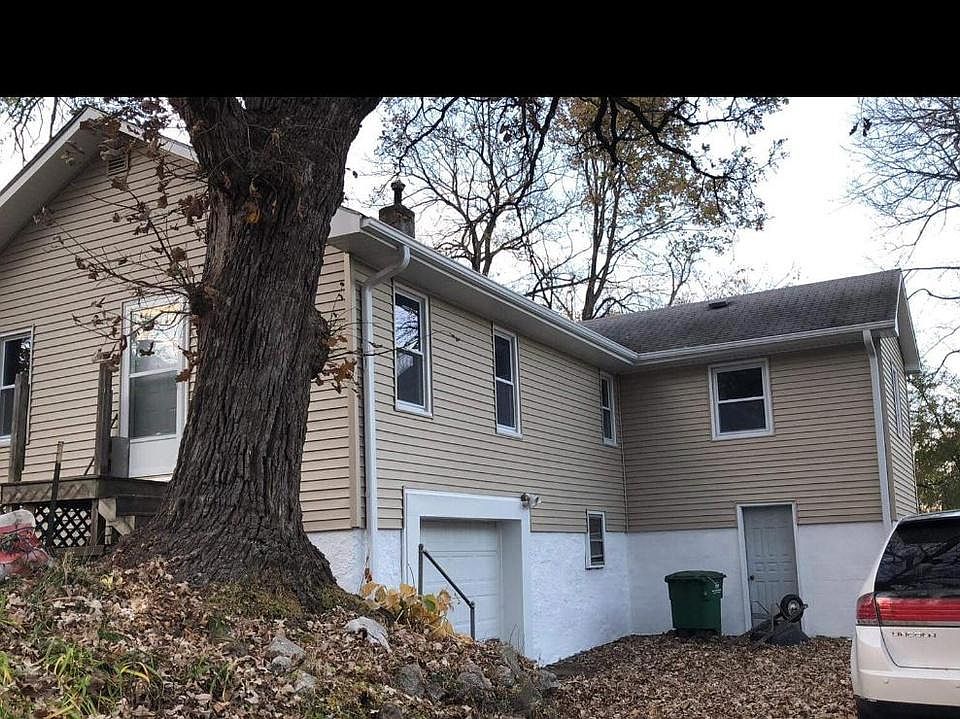 Front of house before new porch/ steps and railing. Tenant is responsible for snow and leaf removal.