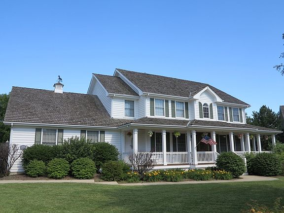 Welcome to this gracious farmhouse style custom home located on a quiet culdesac. Five bedrooms, 3.5