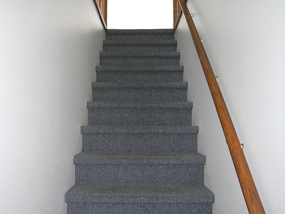 Interior stairs to second floor apartments, secure locked entry