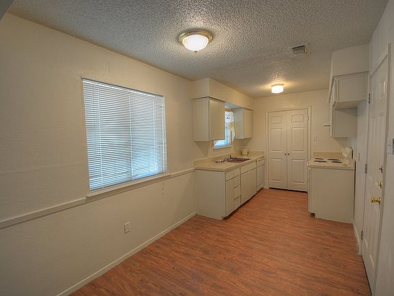 Dining area next to Kitchen overlooks backyard