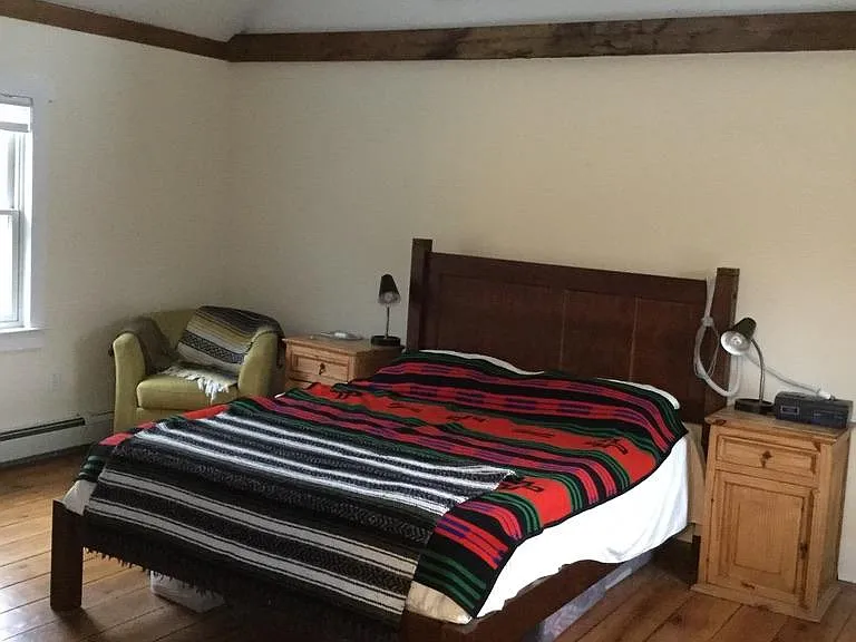Main Bedroom, raised ceiling, old exposed wood beams, nice lighting. beautiful floors
