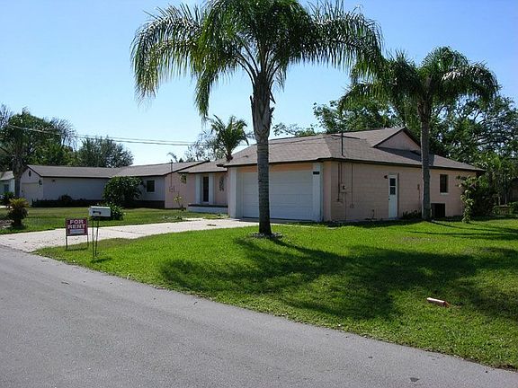 Front-pre beige paint job and landscaping