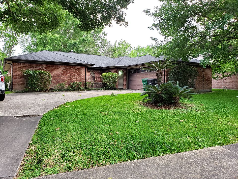 two car garage, large trees