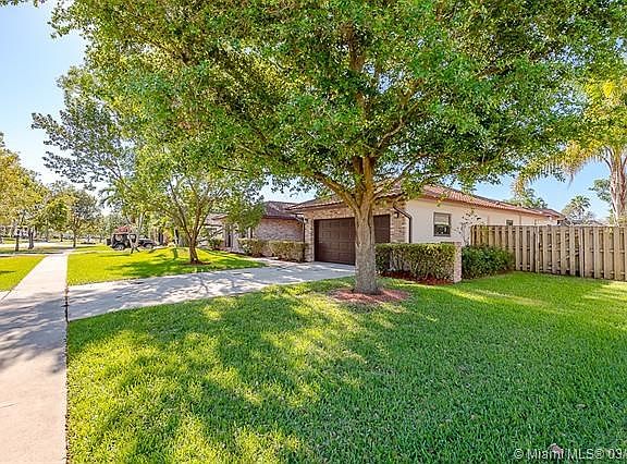 EXTRA LONG DRIVEWAY AND FENCED IN YARD