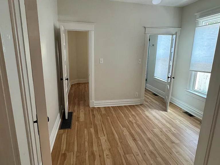 bedroom with access to walk-in closet and bathroom
