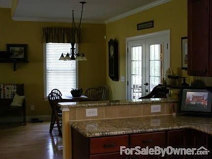 View from kitchen to breakfast area.
						:
						Note the bar area. Great for entertaining or a quck family breakfast.