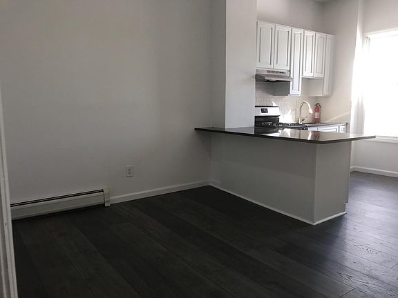 Living room/Kitchen island. It's brighter