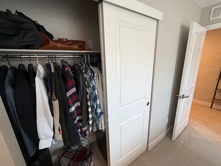 Guest bedroom closet with built-in storage