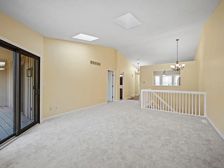 Upper level living area with walk out to deck