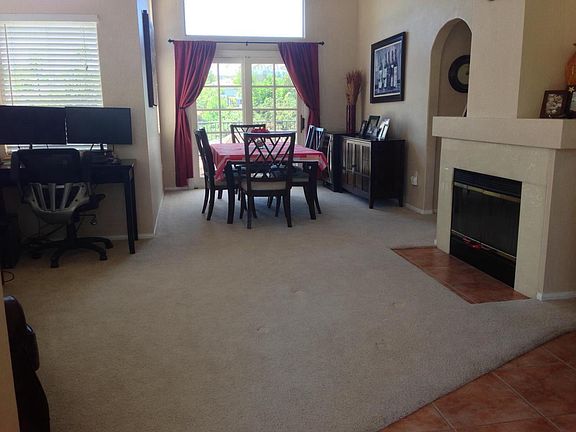 View From Main Door. Left is family room(now all tile) out to dining room and backyard.