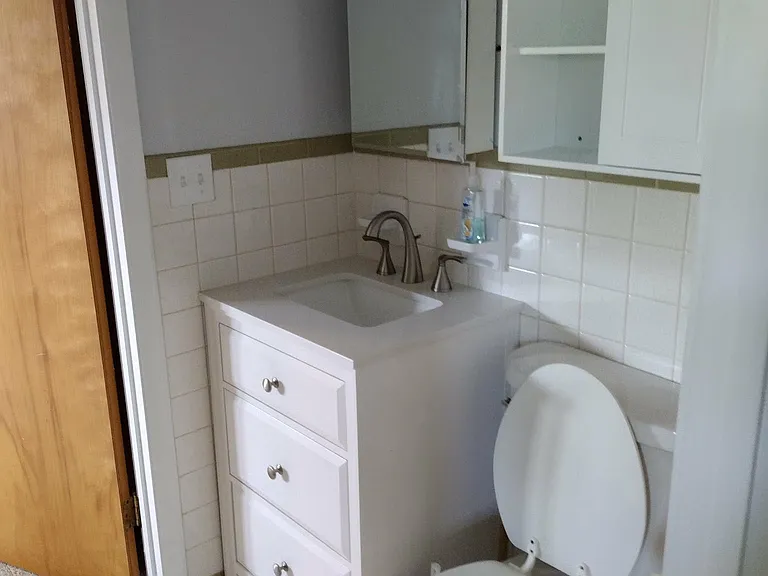 jack and jill half bathroom in between 2 bedrooms
