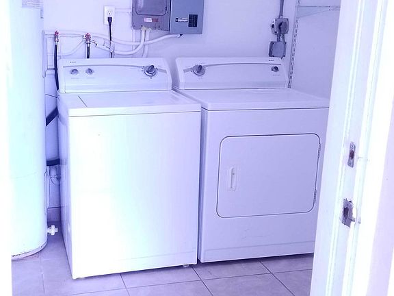 Utility room, seen from door of carport parking