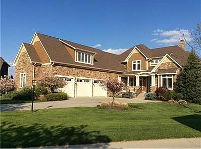 Custom Craftsman Style Home, cul-de-sac, walkout basement, pond, stone wrap on entire home, 1/2 acre, professional landscaping, covered porch....this is worth a look!