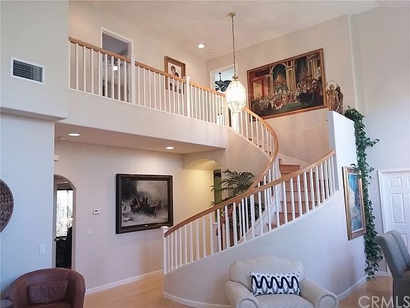 Stunning Spiral Staircase Really Makes a Statement Upon Entering This Beautiful Home!