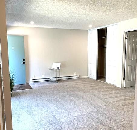 Livingroom from the dining room, looking tours the front door.