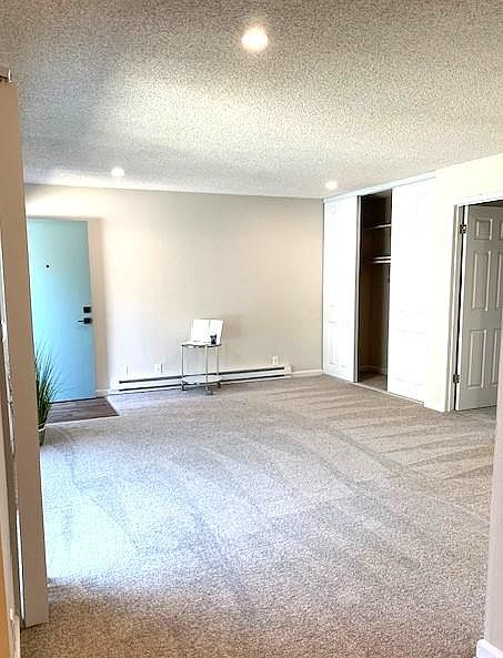 Livingroom from the dining room, looking tours the front door.