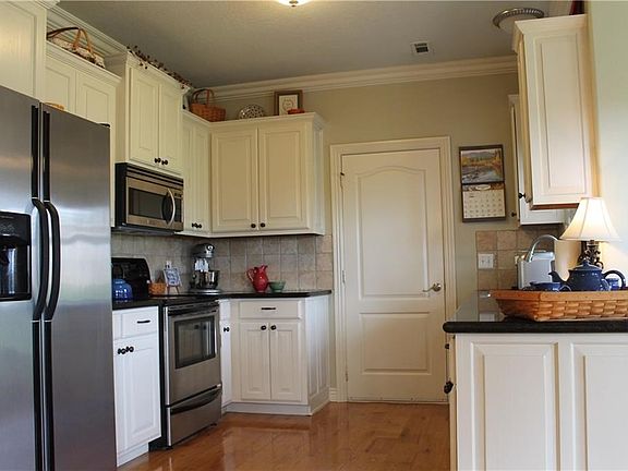 Hardwood floors and granite counter tops highlight this beauty