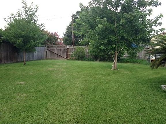 'part' of back yard.  View of side gate entrance
