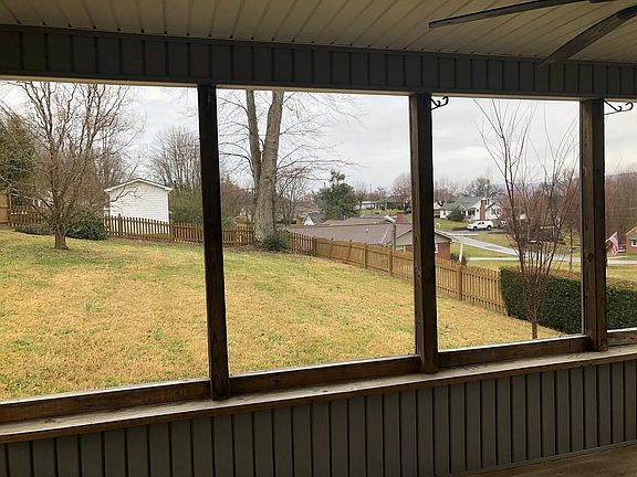Screened back porch with ceiling fan