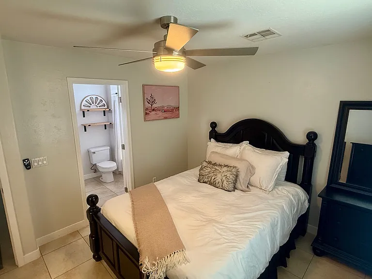 Queen Bedroom 2 with dresser, walk in closet, on-suite double sink bathroom