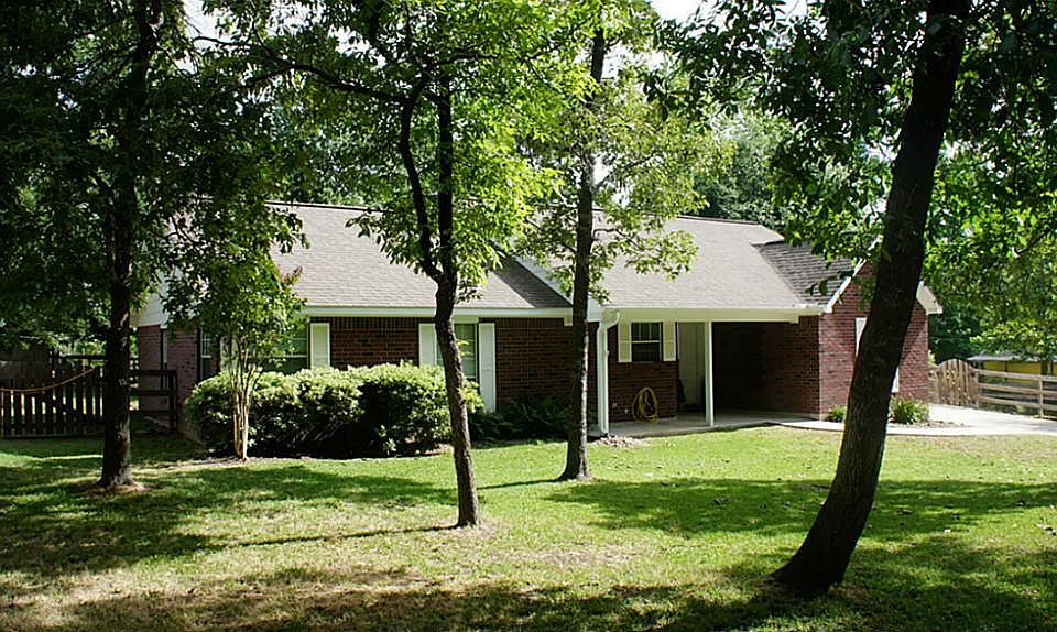 Gorgeous well maintained custom brick home on a park like setting!