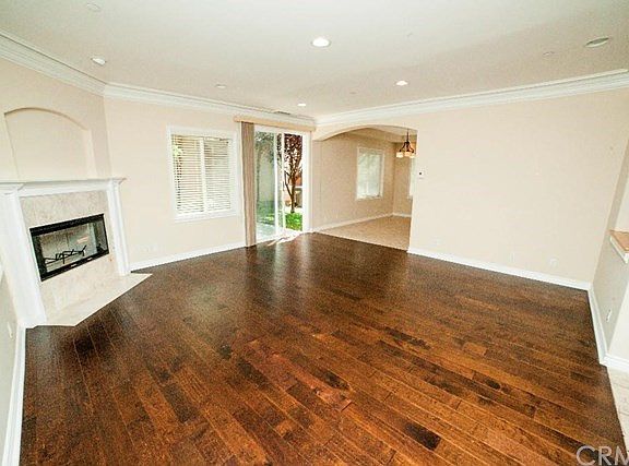 Formal living room with entrance to backyard.