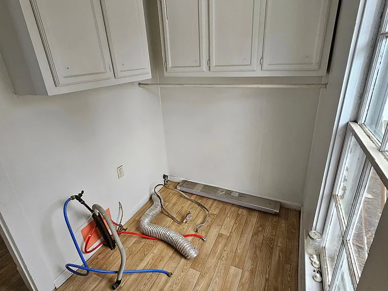 Nice laundry area with lots of cabinet space and washer/dryer hook ups