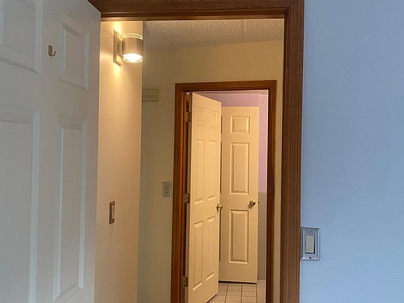 view from bedroom into hallway toward bathroom (washer/dryer hookup is in hallway but not seen in this photo)