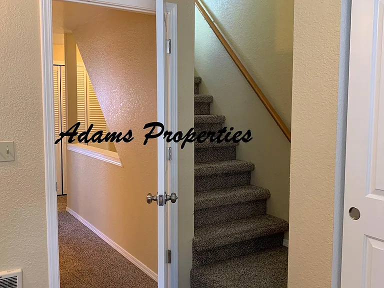 larger bedroom w stairs to loft area