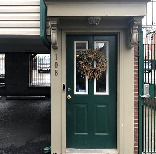 Entrance to the unit with door bell camera and lock.
