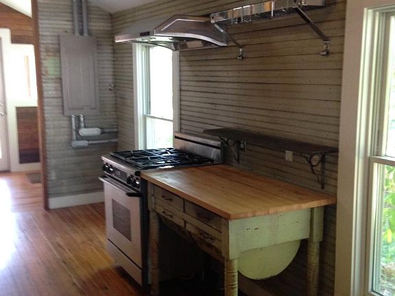 Antique bread table, pot rack, gas stove