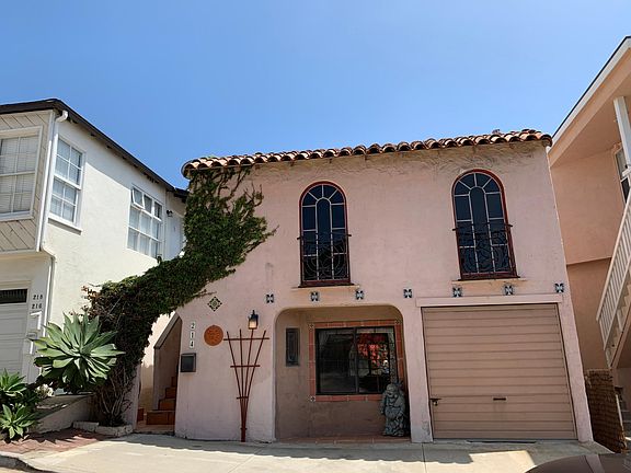 View of the 2 bed / 1 bath apartment in the front of the house. Walk through the archway entrance and up the stairs to the front door.