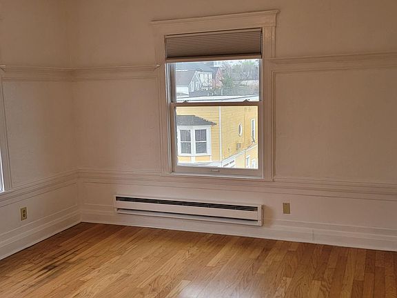 main room facing out with door to kitchen on the right