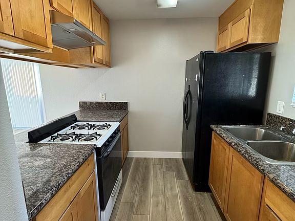Kitchen with new paint and new flooring and granite countertops