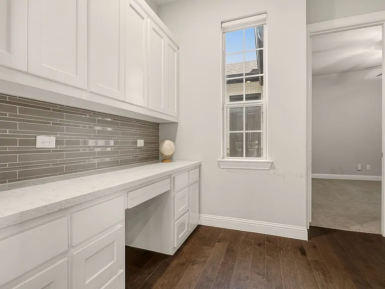 Built in Desk and Cabinetry next to Kitchen.