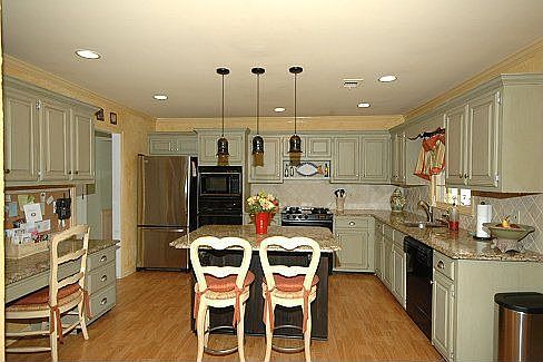 Updated kitchen with granite and glazed cabinets