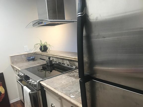 Kitchen comes with, dishwasher, pots, pans, microwave, toaster, and utensils