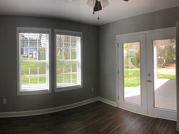 5th Bedroom or Dining/Office with rear door leading to covered porch.