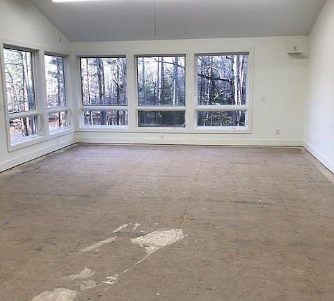 This bright, open, inviting space can be designed to meet your needs. Flooring is currently conducive to artistic endeavors. New flooring negotiable if needed.