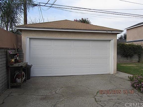 At the end of the driveway sits the 2 car garage.  That is a Deluxe Wayne Dalton Pinch Resistant Garage Door - just 2 years old.
